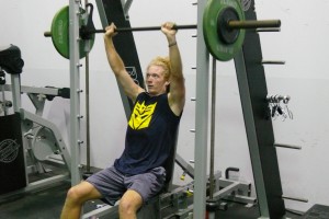 Freshman Jordan Coates puts the student weight room in the Winthrop King Centre to good use as he works out one morning. Though students feel the student workout room needs revamping, administration is increasing athletic choices for non-athletes.